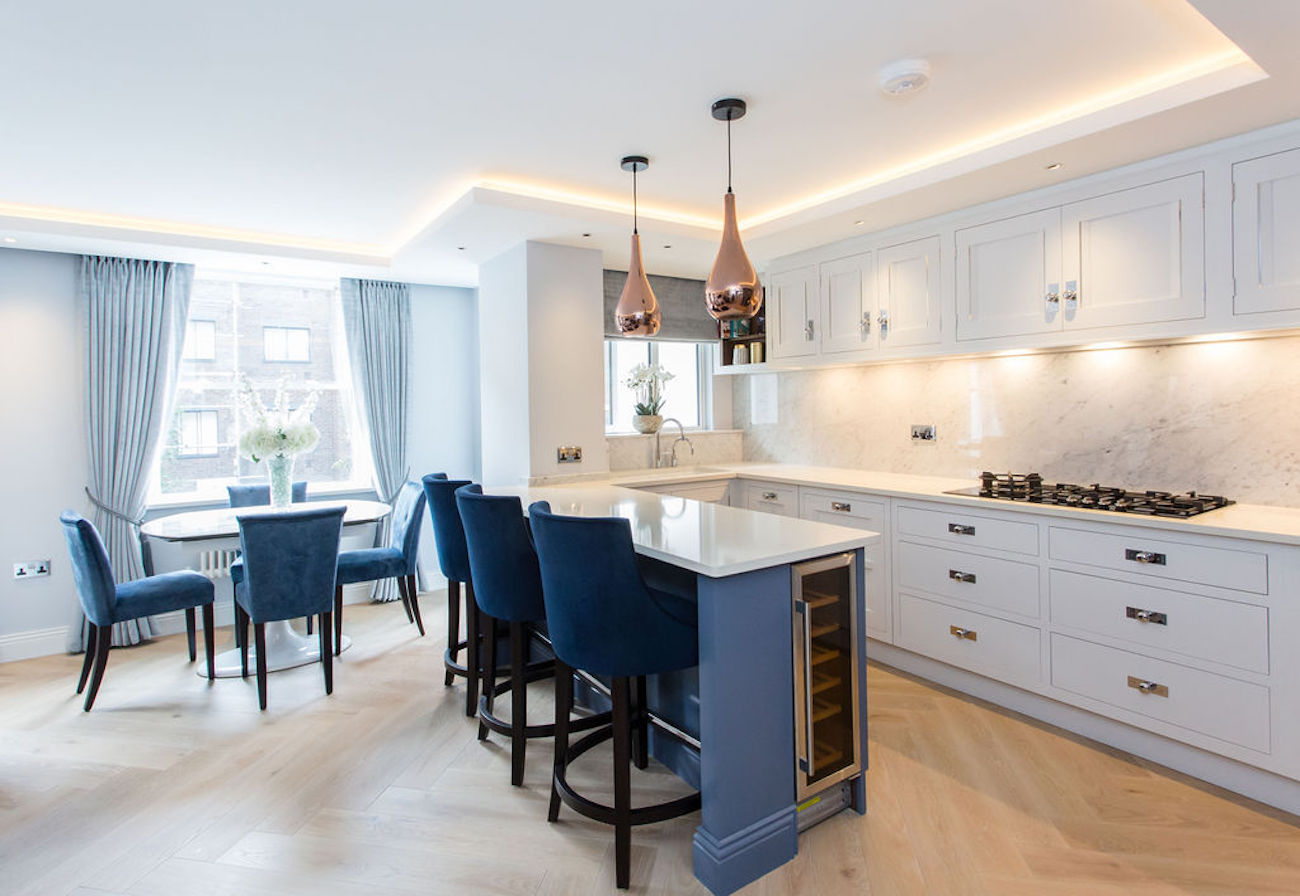 kitchen with navy bar stools and kitchen island