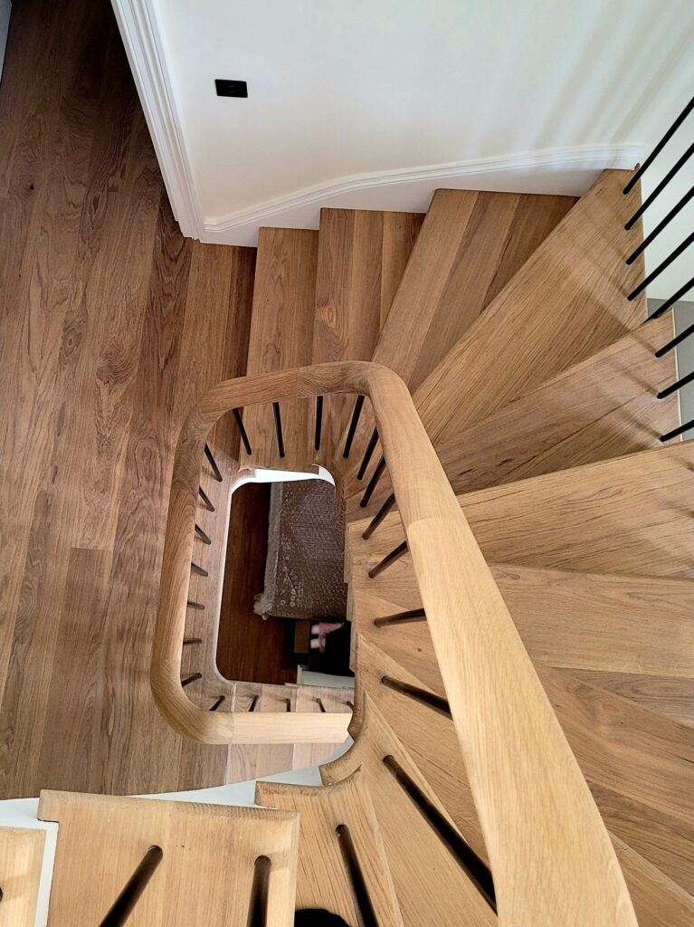 looking down onto a curved staircase from above