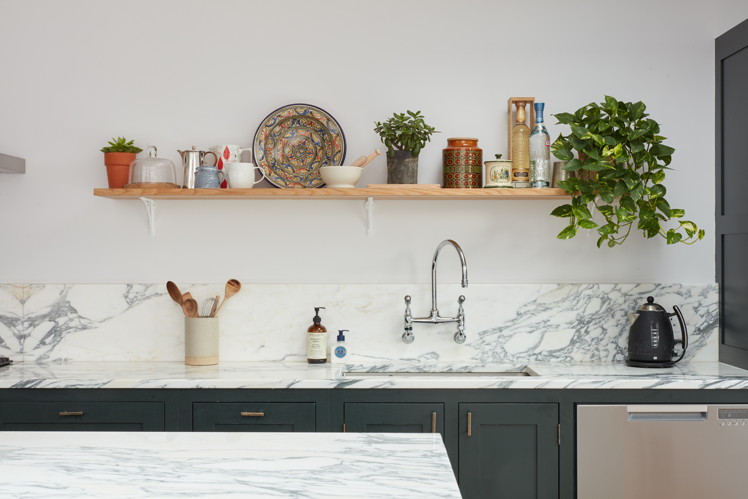 kitchen worktop with floating shelves and sink