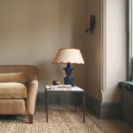 living room with beige sofa and ornate lamp